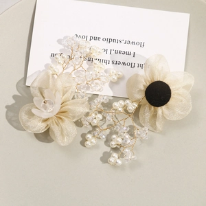 Handmade mesh flower hair accessory with pearls and gold wire tassels for bridal hair