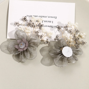 Close-up of handmade mesh flower accessories with wire-wrapped beads and pearls