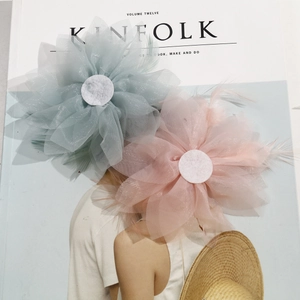 Handmade mesh flower accessories with feathers and crystals in soft pink and grey-blue
