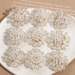 Macro view of crystal teardrop beads woven into flower-shaped DIY jewelry accessories