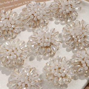 Detailed view of handmade woven flower beads featuring transparent teardrop glass petals