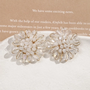 Elegant beaded flower earrings with white frost beads and clear crystal drop petals