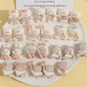 Detailed view of assorted flocked resin bears and bunnies for DIY crafting projects