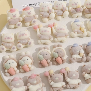 Detail of flocking resin cartoon bears and rabbits on a white round tray for DIY crafts