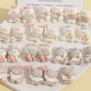Detailed macro view of flocking resin cartoon bears and bunny charms for DIY jewelry making