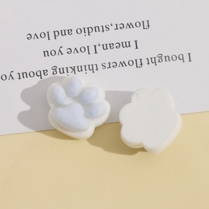 Detailed view of DIY cat paw resin patches with soft blue flocking and smooth white back
