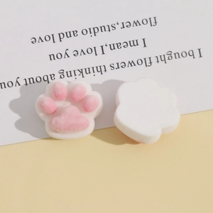 Detailed view of plush cat paw resin charms with soft pink pads for DIY craft accessories