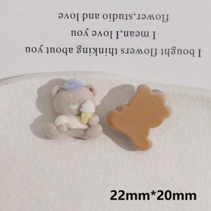 Macro view of brown flocked bear charm with blue hat and ice cream, size 22mm x 20mm