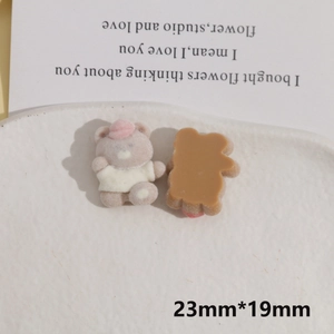 Macro detail of flocking bear resin charms with 23mm size measurements and soft texture
