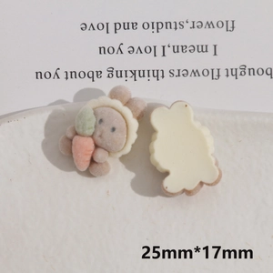 Detail of DIY flocking rabbit resin patch holding an orange carrot for handmade crafts
