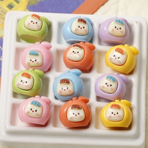Macro shot of 12 colorful cartoon resin fruit baby charms for DIY crafts and accessories
