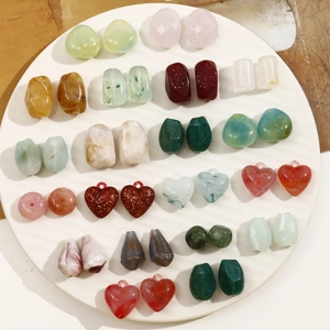 Macro shot of assorted acrylic heart and oval beads with marble finish for DIY jewelry