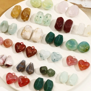 Detail of assorted acrylic beads with marble texture and glitter for DIY jewelry making
