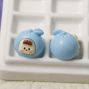 Macro shot of cute light blue fruit baby resin charm for DIY hair clips and jewelry