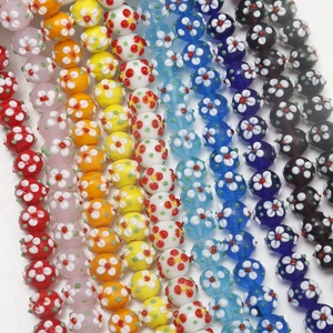 Macro detail of colorful millefiori glass flower beads for DIY jewelry making