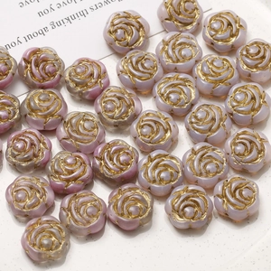 Macro view of lavender Czech glass rose beads with gold edges for DIY jewelry making
