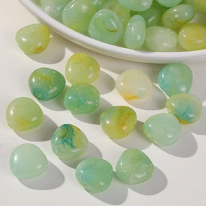 Translucent green and yellow marbled acrylic beads in heart and teardrop shapes