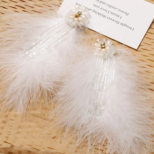 Elegant white feather drop earrings with crystal flower beads and tassel long pendants