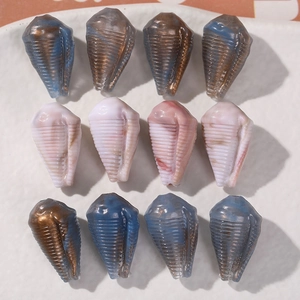 Macro shot of 12 spiral shell acrylic beads for DIY jewelry making in assorted colors