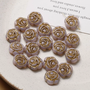 Detailed view of lavender rose Czech glass beads with gold edges for DIY jewelry