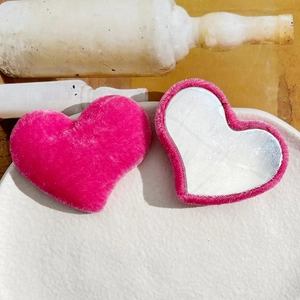 Pink velvet heart hair accessories with plush texture and mirrored surface for DIY crafts