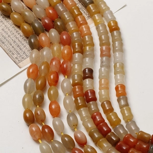 Close-up of mixed color bamboo-shaped jade beads for DIY jewelry making and crafts