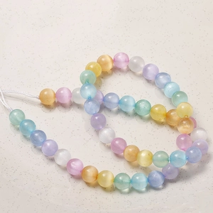 Vue macro de perles œil de chat arc-en-ciel 8mm avec éclat soyeux pour bijoux DIY