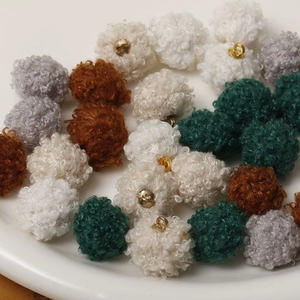 Winter faux fur pompom charms in white, grey, brown, and green with golden metal loops