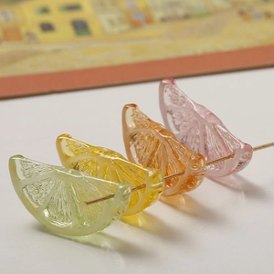 Macro detail of translucent resin lemon slice charms with realistic fruit pulp textures