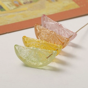 Translucent resin citrus fruit slice pendants in green, yellow, orange and pink