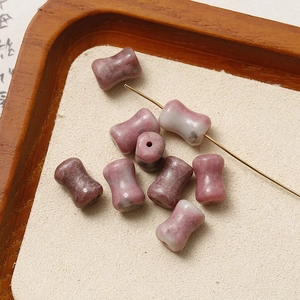 Macro shot of pink natural stone drum beads for DIY jewelry with unique mineral textures