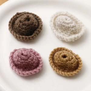 Miniature handmade crochet cotton hats in four colors for DIY crafts and accessories