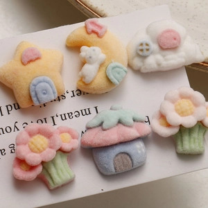 Close-up of DIY resin charms with flocked texture in cute cloud and bunny house shapes