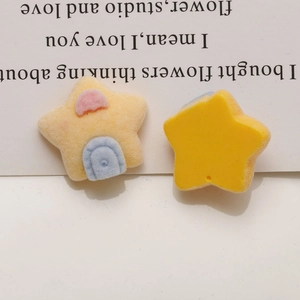 Macro detail of yellow flocked star resin charms for DIY crafts showing front and back