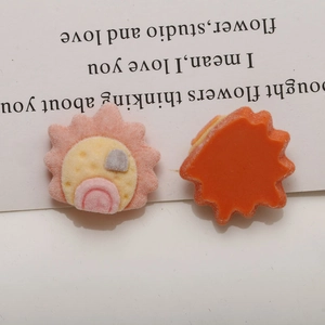 Detailed view of flocked sun-shaped resin charm for DIY hair accessories and crafts