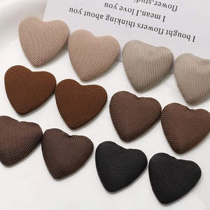 Minimalist fabric heart buttons in neutral tones for DIY hair accessories and crafts
