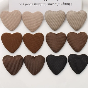 Set of 12 heart-shaped fabric patches in earth tones for DIY hair accessories