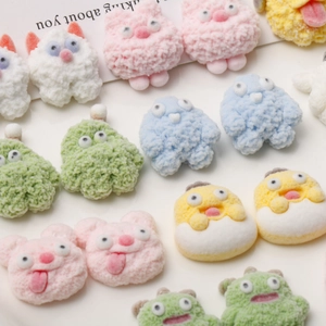 Macro detail of colorful flocked monster and animal resin charms for DIY craft projects