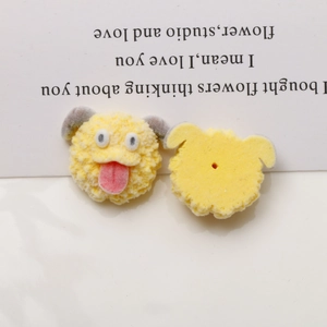 Front and back view of yellow plush dog charm with pink tongue and flat mounting base