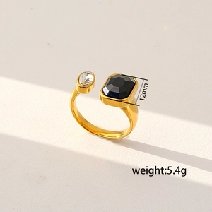 Detail of gold open ring with 12mm black stone and clear crystal, weighing 5.4g