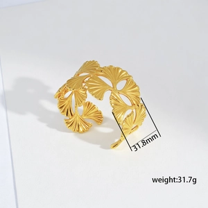 Detailed view of wide gold ginkgo leaf open bangle with size and weight specs