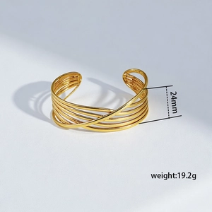 Detail view of 24mm wide gold titanium steel cuff with weight and size specifications