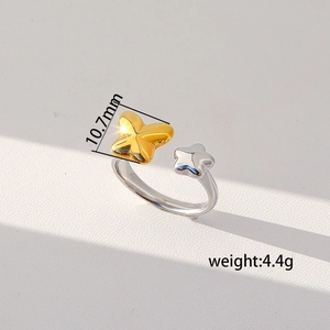 Detailed view of adjustable butterfly and star ring with 10.7mm size and 4.4g weight specs