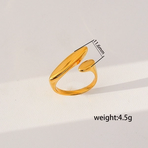Detail view of golden open ring showing 11.6mm width and polished minimalist design