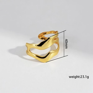 Detail shot of golden irregular wave bangle showing 40mm height and 23.1g weight specs