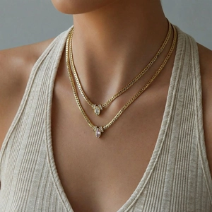 Gold layered snake chains with marquise cut pink and white zirconia pendants on model