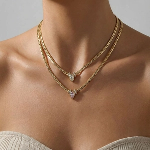 Layered 18K gold plated herringbone chains with marquise cut zircon drop pendants