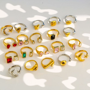 Variety of colorful crystal rings in gold and silver plating with celestial motifs