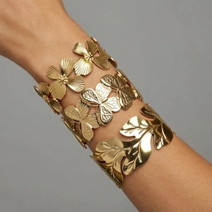 Golden titanium steel open bracelet set with textured heavy duty floral and leaf designs