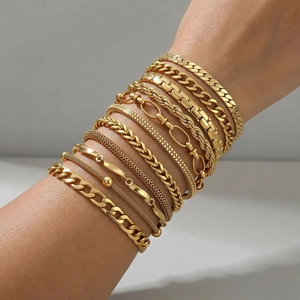 Stack of eleven diverse gold plated stainless steel geometric chain bracelets for women